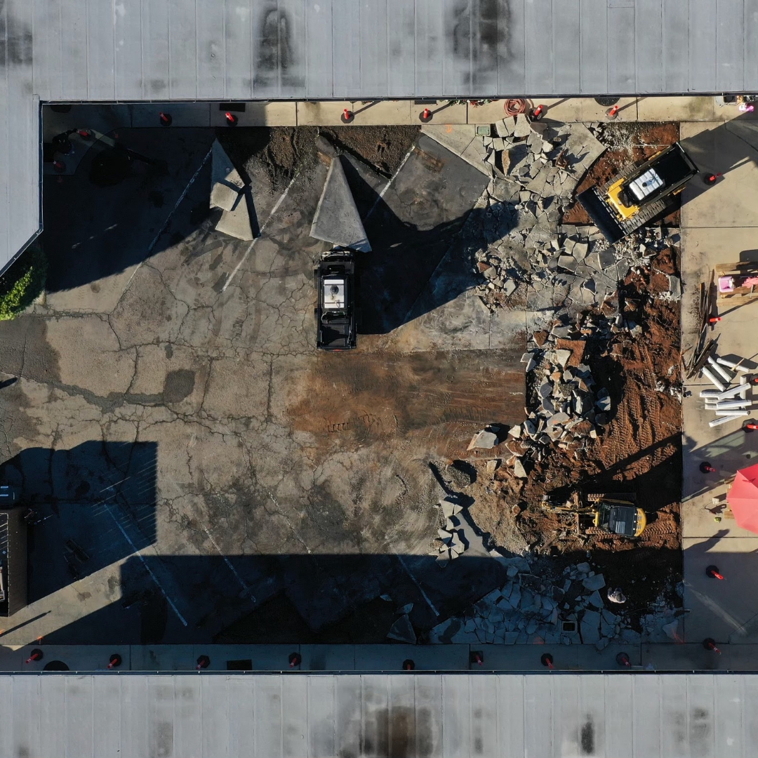 Overhead shot of asphalt being removed in construction site