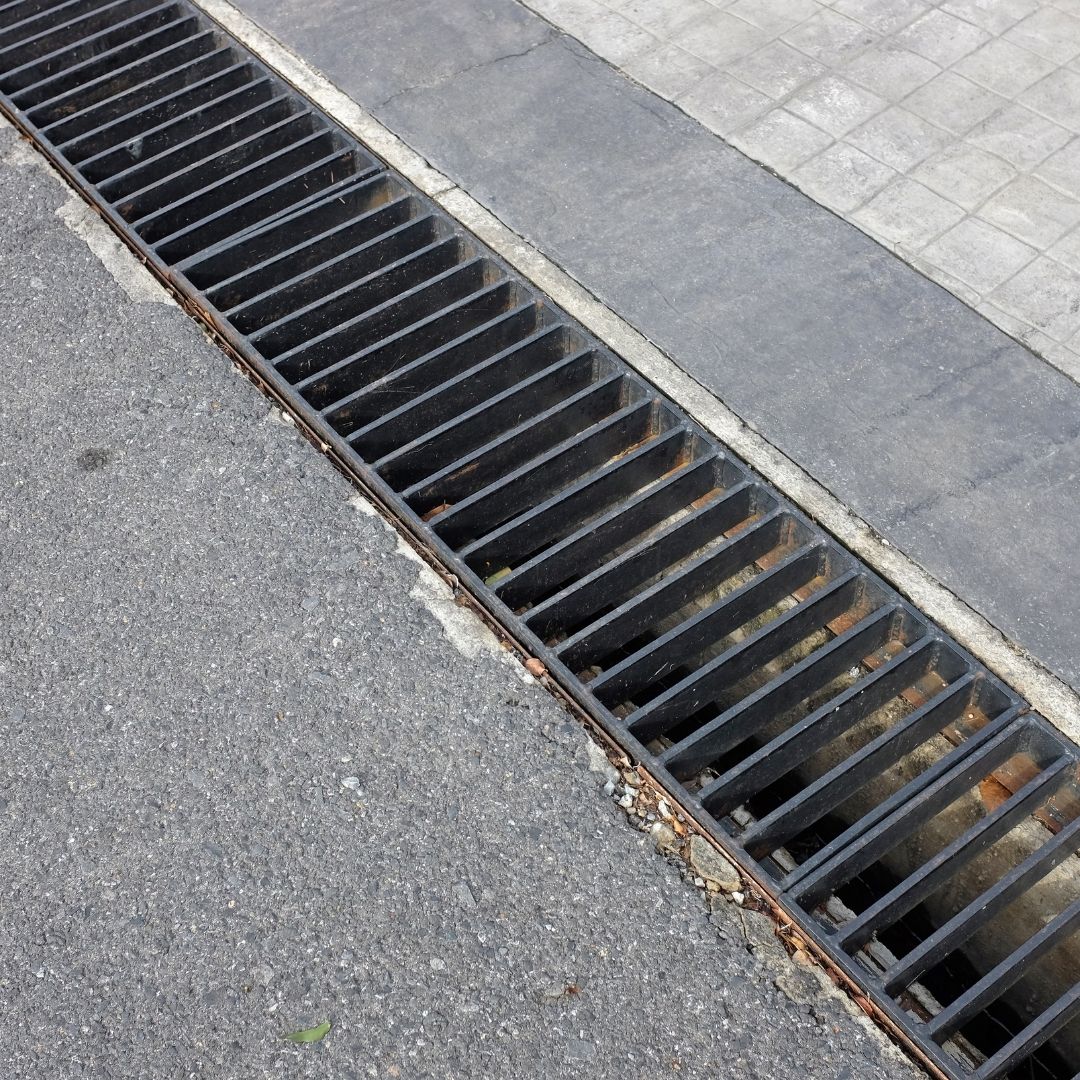 Commercial driveway or parking lot grate