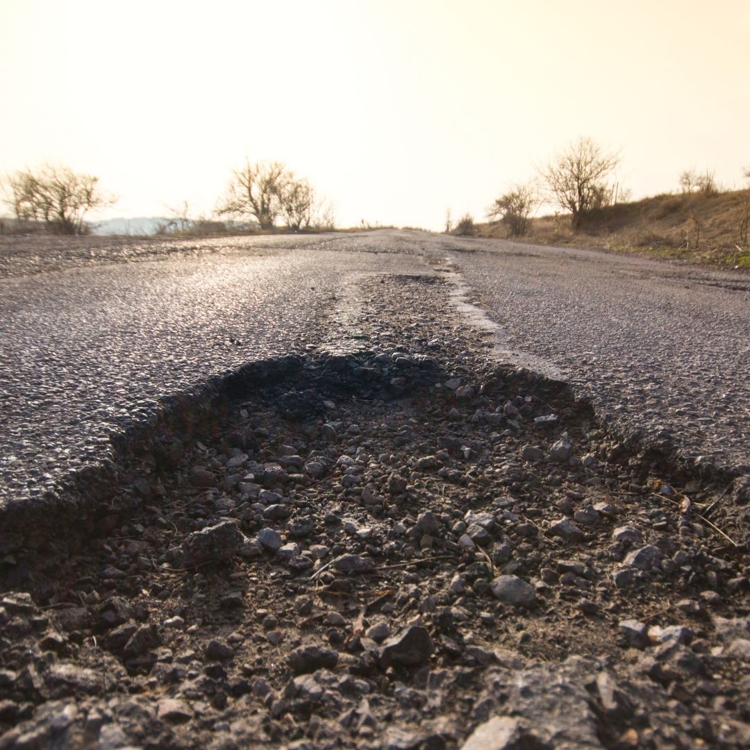 what causes potholes in the road